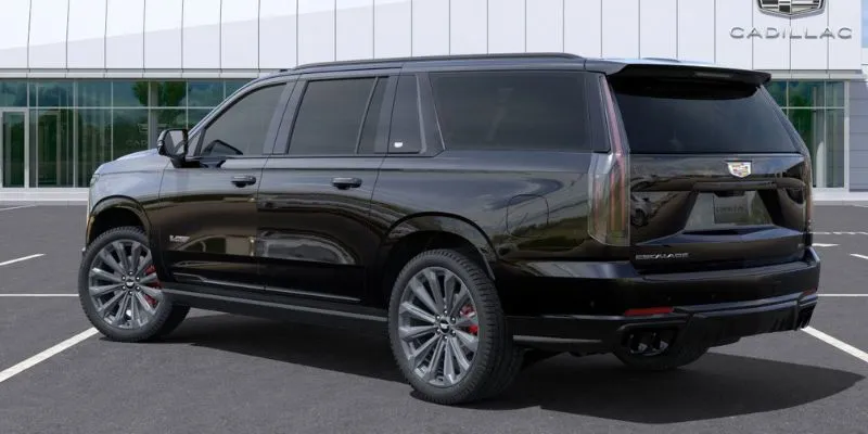 Rear view of a black Cadillac Escalade luxury SUV used for private car and chauffeur service