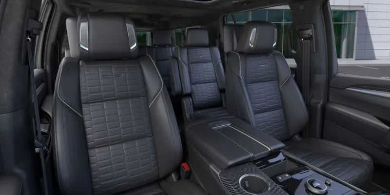 Premium leather passenger seating with captain chairs inside a spacious Cadillac Escalade executive SUV