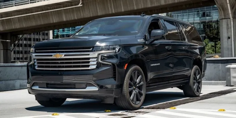 Black Chevrolet Suburban executive SUV parked for luxury ground transportation and airport transfers