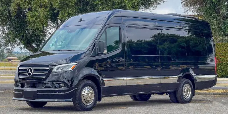 Black Mercedes-Benz Sprinter executive passenger van parked for corporate group transportation