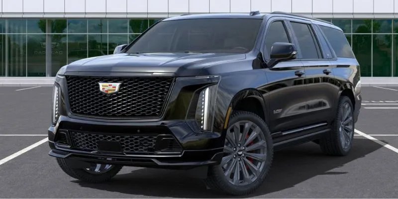Black Cadillac Escalade ESV parked in front of a glass office building