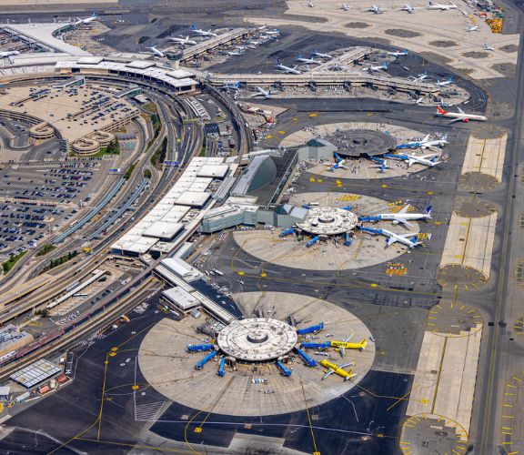 Aerial view of Newark Liberty International Airport terminals with aircraft parked at the gates